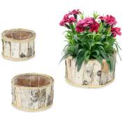 3 pots de fleurs en bois, design rond, chacun ayant