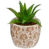 Plante artificielle verte dans un pot en céramique