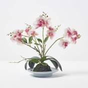Orchidée artificielle rose dans un bol en céramique